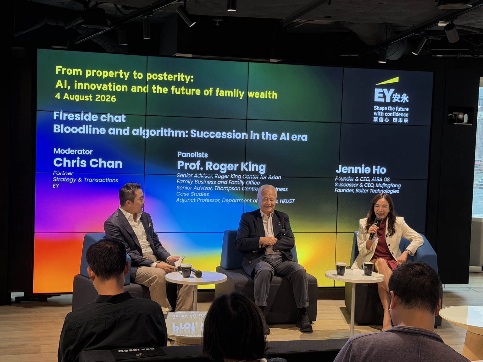 Jennie Ho speaking with Professor Roger King and Chris Chan at EY in Hong Kong